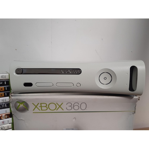 1073 - A boxed Xbox 360 console with leads, three controllers and a large selection of games to include Bat... 