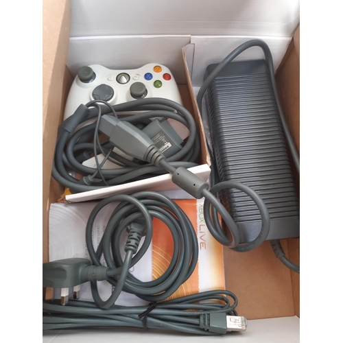 1073 - A boxed Xbox 360 console with leads, three controllers and a large selection of games to include Bat... 