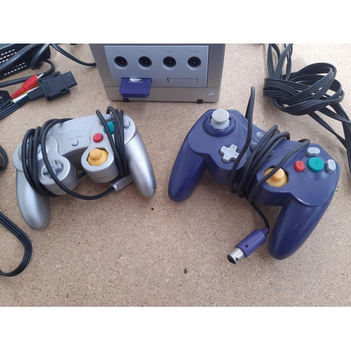 1074 - A Nintendo Game Cube console with leads, two controllers and memory card