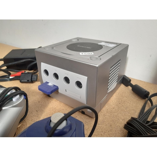 1074 - A Nintendo Game Cube console with leads, two controllers and memory card