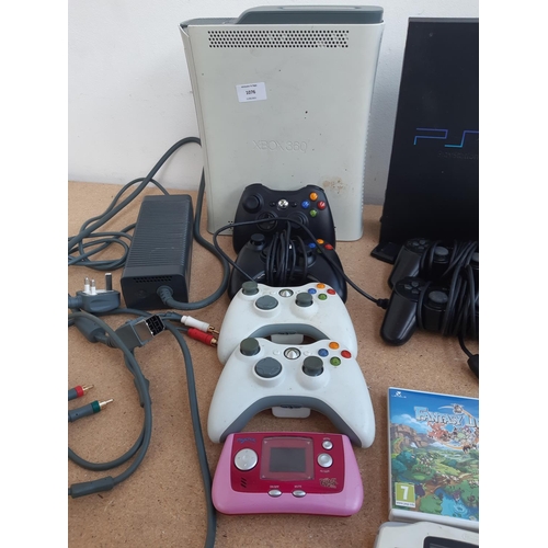 1076 - Two boxes containing Xbox 360 console with leads, power supply and controllers, Nintendo Wii with co... 