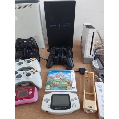 1076 - Two boxes containing Xbox 360 console with leads, power supply and controllers, Nintendo Wii with co... 