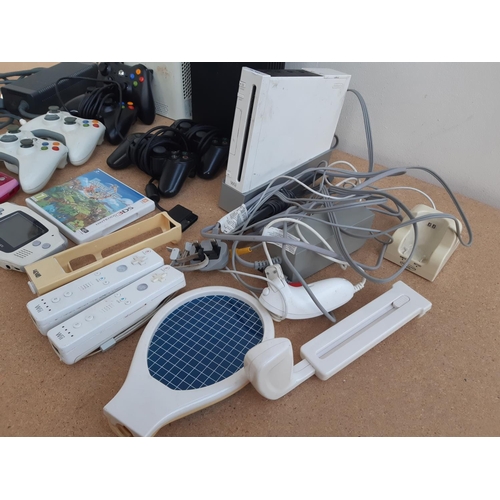 1076 - Two boxes containing Xbox 360 console with leads, power supply and controllers, Nintendo Wii with co... 