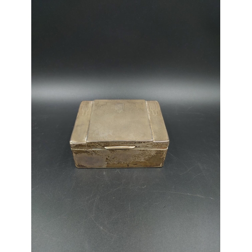 259 - An Art Deco EPNS engine turned cigarette box - measuring approx. 4.5cm high x 11.5cm wide and 8.5cm ... 