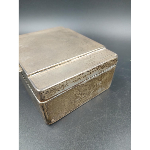 259 - An Art Deco EPNS engine turned cigarette box - measuring approx. 4.5cm high x 11.5cm wide and 8.5cm ... 