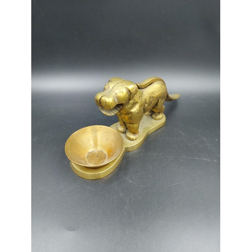 335 - A vintage novelty brass nut cracker in the form of a dog