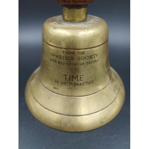 342 - A mid 20th century Scope brass and oak handled charity bell with inscription - approx. 23cm high