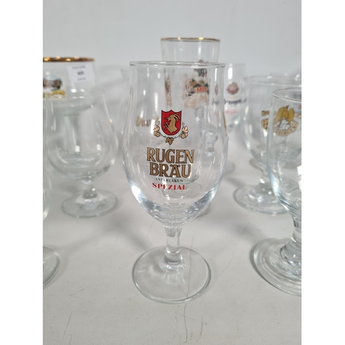 409 - Eighteen various Belgian beer glasses to include Kwak with wooden stand, Rugenbrau, Grimbergen, Hoeg... 