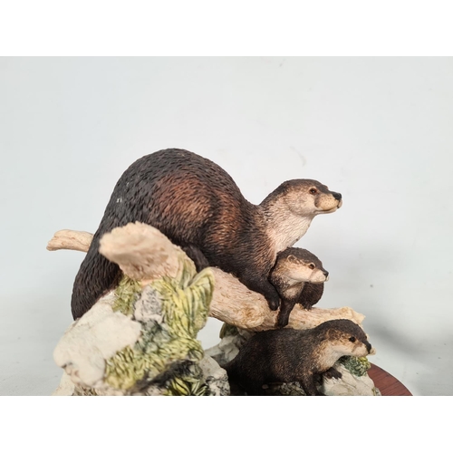 415 - Two otter figurines, one Border Fine Arts limited edition 629/2000 'Late Thaw' and one Soli Deo Orkn... 