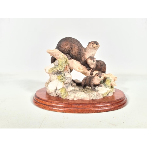 415 - Two otter figurines, one Border Fine Arts limited edition 629/2000 'Late Thaw' and one Soli Deo Orkn... 