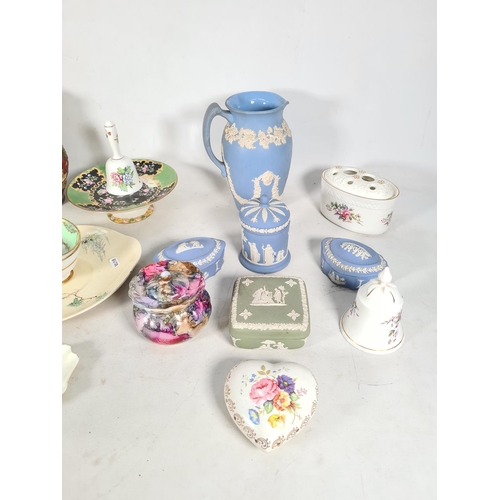 433 - A collection of various ceramics to include three Wedgwood pale blue Jasperware trinket boxes, one W... 