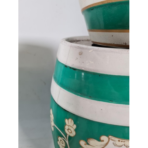 437 - Seven various ceramic liquor barrels, four vintage green & white barrels to include 'rum', 'pear bra... 