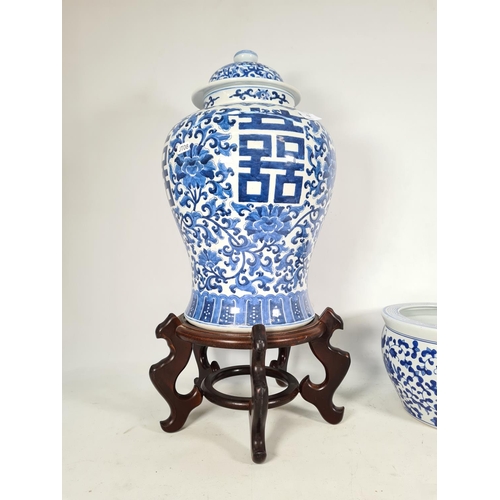 438 - Two Oriental blue & white ceramic items, one jardinere with wooden stand and one 43cm ginger jar wit... 