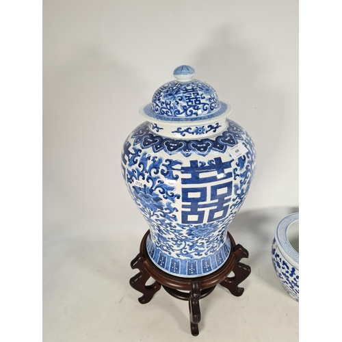 438 - Two Oriental blue & white ceramic items, one jardinere with wooden stand and one 43cm ginger jar wit... 