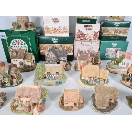 440 - A large collection of 'Lilliput Lane' cottages to include Watermill, Wheyside, Bramble cottage, Brit... 