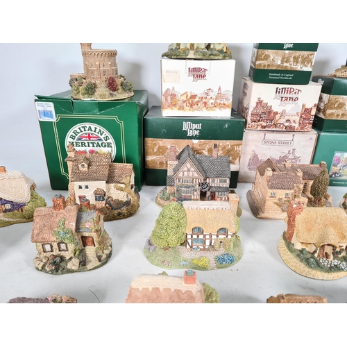 440 - A large collection of 'Lilliput Lane' cottages to include Watermill, Wheyside, Bramble cottage, Brit... 