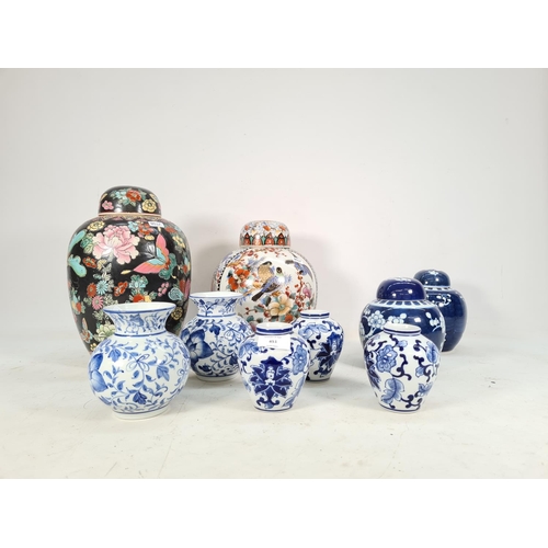 451 - Nine various Oriental ginger jars and vases to include three matching 10cm blue & white vases, two 1... 