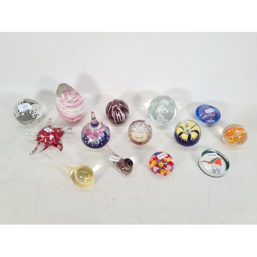 452 - Fourteen various art glass paperweights to include Murano duck, Murano style millefiori, Mdina limit... 