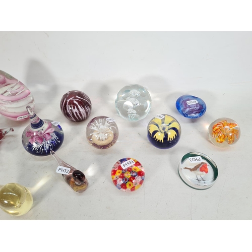 452 - Fourteen various art glass paperweights to include Murano duck, Murano style millefiori, Mdina limit... 