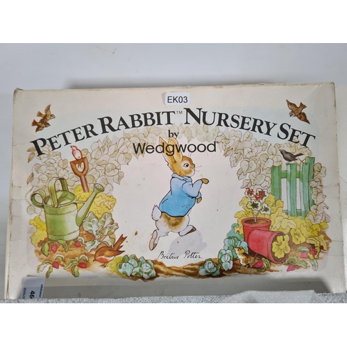 460 - A boxed Wedgwood Peter Rabbit four piece nursery set comprising plate, porringer, mug and egg cup