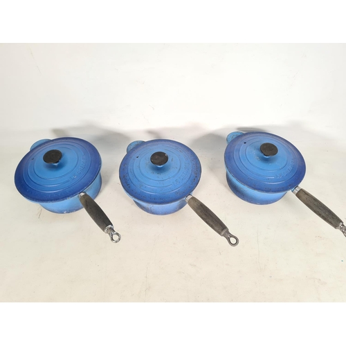 471 - Three Le Creuset blue enamel cast iron saucepans