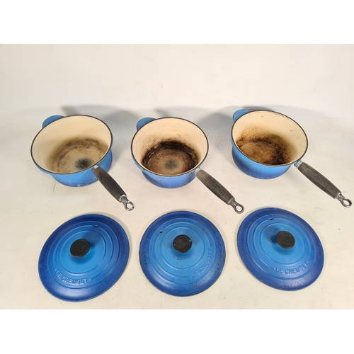 471 - Three Le Creuset blue enamel cast iron saucepans