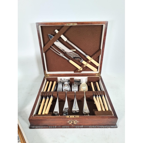 473 - A vintage oak cased fifty three piece canteen of cutlery and a vintage leather cased twelve piece fi... 