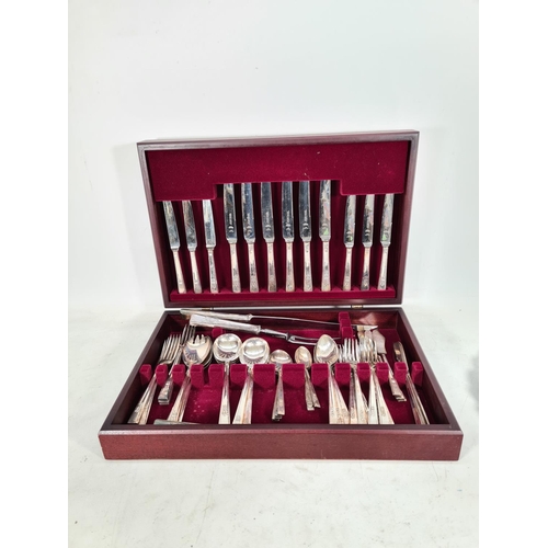 476 - A collection of various metalware to include a Priestley & Moore Ltd. mahogany cased sixty one piece... 