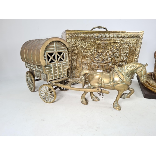 486 - Three pieces of brassware, one horse and cart model - approx. 51cm long, one embossed brass two divi... 