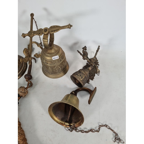 490 - Four vintage brass bells and one brass bracket