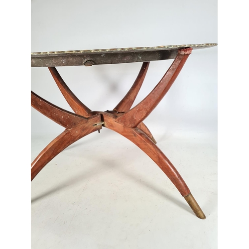 496 - A Middle Eastern travel table with brass oval tray and wooden stand - approx. 42cm high x 49cm wide ... 