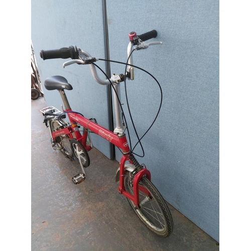 1200 - A red Riese and Muller Birdie folding bicycle with quick release wheels, Tektro brakes, rear carrier... 