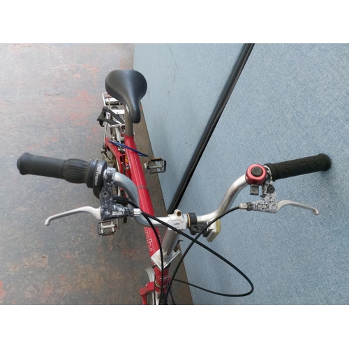 1200 - A red Riese and Muller Birdie folding bicycle with quick release wheels, Tektro brakes, rear carrier... 