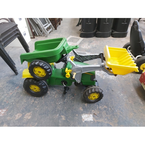 1204 - A red and white child's ride on electric car together with a child's ride on pedal tractor, front lo... 