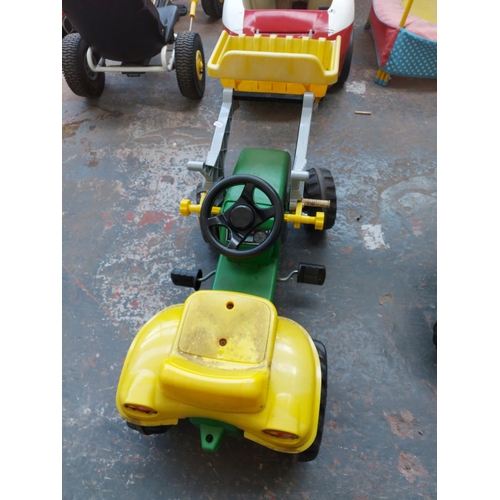 1204 - A red and white child's ride on electric car together with a child's ride on pedal tractor, front lo... 