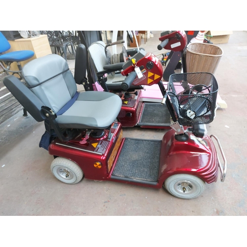 1209 - A red Shoprider Deluxe four wheeled mobility scooter with front shopping basket, instruction manual,... 