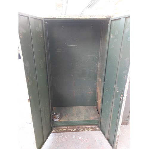 1213 - Two vintage metal workshop cabinets, one Milners with two doors and internal shelving - approx. 6' x... 