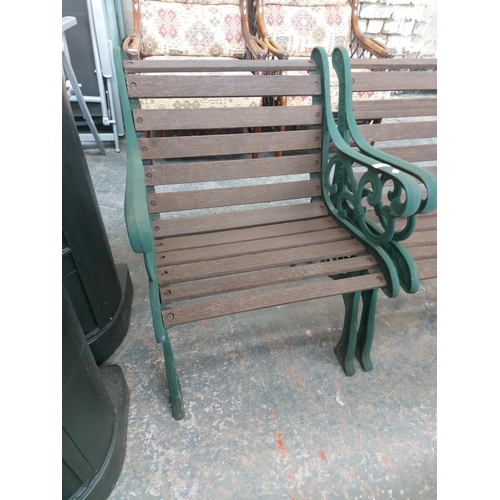 1225 - Two items, one wooden slatted three seater garden bench and one chair on green painted ornate cast i... 