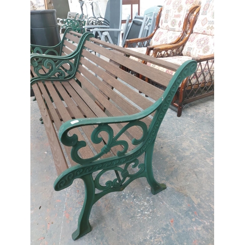 1225 - Two items, one wooden slatted three seater garden bench and one chair on green painted ornate cast i... 