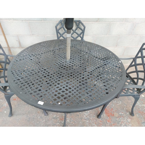 1230 - A six piece cast aluminium patio set comprising circular pedestal table - approx. 1.2 metres in diam... 