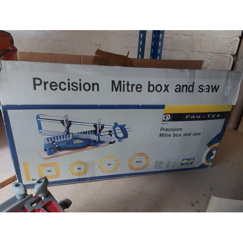 1232 - Two items, one boxed Pro-Tek precision mitre box and saw and one red Arcoy dovetailing jig