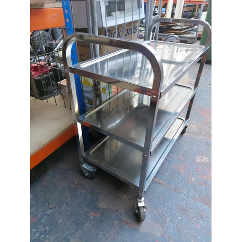 1241 - A polished aluminium three tier medical trolley - approx. 85cm x 89cm x 44cm