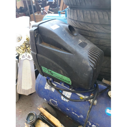 1245 - Three items, one blue oil free air compressor and two trolley jacks