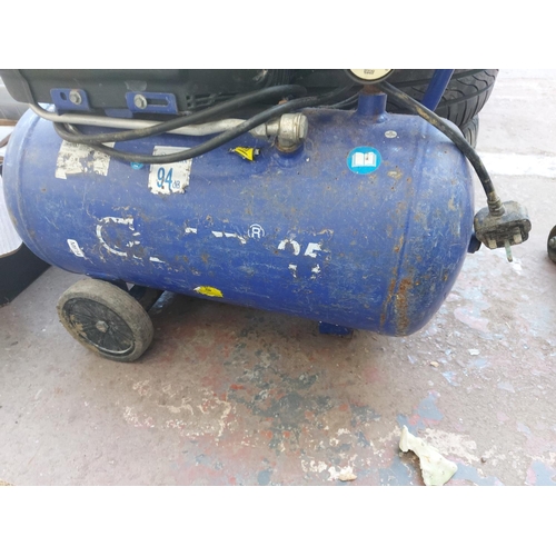 1245 - Three items, one blue oil free air compressor and two trolley jacks