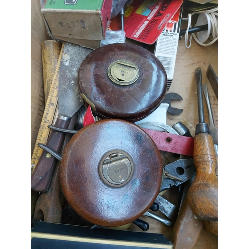 1245A - Two boxes containing two vintage leather and brass Chesterman tape measures, wooden handled screwdri... 