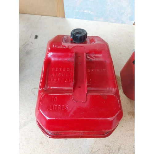 1267 - Four red metal petrol cans