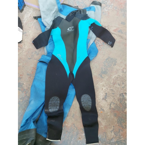 1268 - A bag containing various scuba diving equipment to include Azdry drysuit, Circle One size 12 wetsuit... 