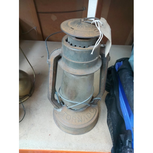 1269 - Four items, one Tornado storm lantern, one black enamel and gold Tilley paraffin lamp, one Meva stor... 