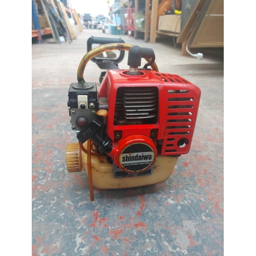 1277 - A black and red Shindaiwa petrol strimmer