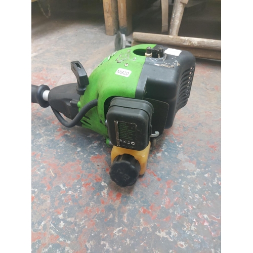 1279 - A black and green Gardentec petrol strimmer